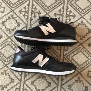 Black and rose gold New Balance sneakers